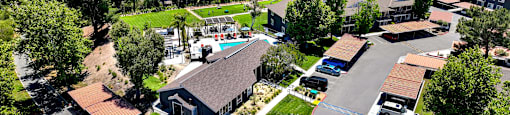 an aerial view of a neighborhood with houses and cars on the street at Monterra Ridge Apartments, Canyon Country