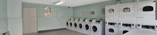 a washer and dryer laundry room with a counter and benches at Sunset Square Apartments, West Covina, California, 91790