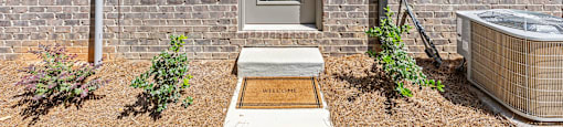 the front of a brick house with a door and a hot tub at The Collection Charlotte in Charlotte, NC, 28205