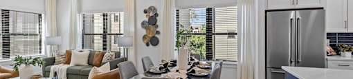 a living room with a kitchen and a dining table at The Collection Charlotte in Charlotte, NC, 28205
