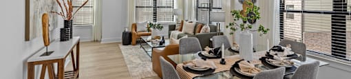 a dining room with a table and chairs and a geometric wallpaper on the wall at The Collection Charlotte in Charlotte, NC, 28205