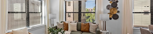 a living room with couches and a glass coffee table at The Collection Charlotte in Charlotte, NC, 28205
