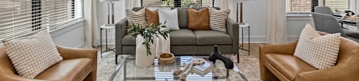 a living room with couches and a glass coffee table at The Collection Charlotte in Charlotte, NC, 28205