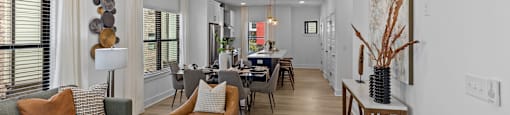 a living room and dining room with a ceiling fan at The Collection Charlotte in Charlotte, NC, 28205