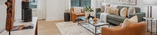 a living room with a couch and a coffee table at The Collection Charlotte in Charlotte, NC, 28205