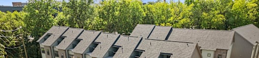 an aerial view of an apartment building with a street in front of it at The Collection Charlotte in Charlotte, NC, 28205