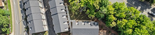 an aerial view of a building with a street and trees at The Collection Charlotte in Charlotte, NC, 28205