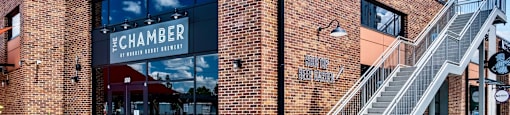 the front of a brick building with a staircase at The Collection Charlotte in Charlotte, NC, 28205