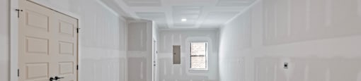 a empty room with white walls and a white door at The Collection Charlotte in Charlotte, NC, 28205