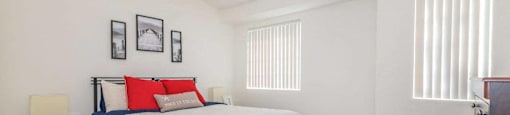 a bedroom with a bed and a closet at Riverview Springs, Oceanside, CA