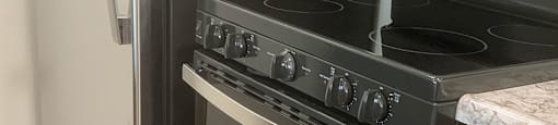 A stainless steel oven with a glass door is in a kitchen  at Victoria Springs, Riverside, CA 92504