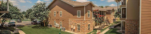 A residential area with houses and green lawns at The Villages at Lost Creek Apartments, San Antonio, TX, 78247