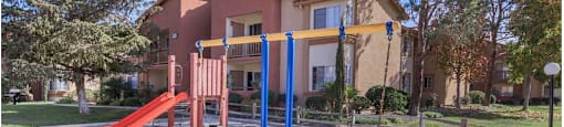 an empty playground in front of a house at Riverview Springs, California