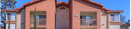 an apartment building with a sidewalk in front of it at Riverview Springs, Oceanside, CA,92058