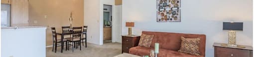 a living room with a couch and a table at Riverview Springs, Oceanside, California