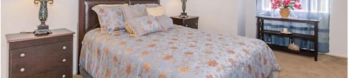 a bedroom with a bed and two dressers and a window at Riverview Springs, Oceanside, CA