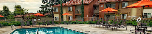 a swimming pool with a hot tub and a resort style pool at Riverview Springs, Oceanside, CA