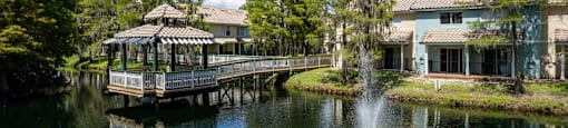 a pond with a fountain at Saratoga Resort Villa Apartments, Kissimmee