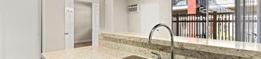 a kitchen with a sink and a window