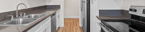 Apartments for Rent in Encino CA - White Oak Terrace - White Kitchen with Stainless Steel Appliances and Silver Hardware