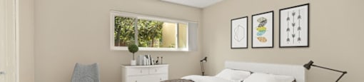 a bedroom with a bed and wallpaper on the wall