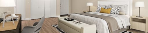 a bedroom with a bed and a desk