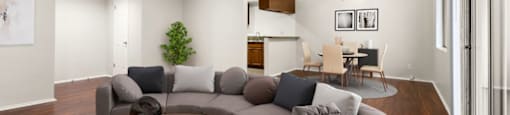 A living room with a grey sofa and a coffee table.