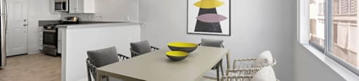 a dining room with a table and a ceiling fan