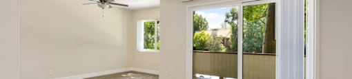 Living Room with Sliding Glass Doors at Lombardi Apartments, Woodland Hills, California