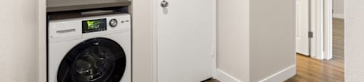 a laundry room with a washer and dryer in it at Lombardi Apartments, Woodland Hills, 91367