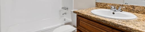 a bathroom with a sink toilet and bathtub
