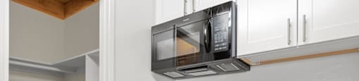 a kitchen with a sink and a microwave