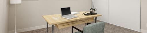 a home office with a laptop on a desk