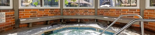 2 Bedroom Apartments in Encino, CA - Brookside Terrace- Covered Spa Hot Tub, with Blue Tile Details and Jets, with a Bench