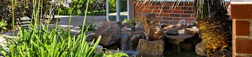 a small pond in front of a building