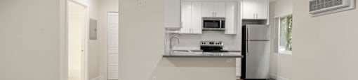 a kitchen with a stove and a refrigerator