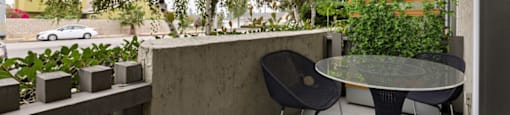 a patio with a table and chairs on a balcony