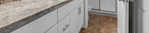 a bathroom with a sink and a toilet at The Meadows at Westlake Village Apartments, CA, 91361