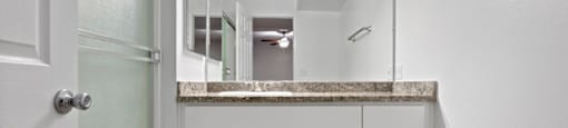 a bathroom with a sink and a mirror at The Meadows at The Meadows at Westlake Village Apartments, Westlake Village, CA