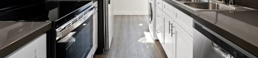 stainless steel appliances, and modern wood cabinets at The Reserve at Warner Center Apartments, Woodland Hills, CA