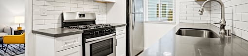 Apartment Valley Village CA - Kling Trio - Modern Kitchen With Sleek Counters and Appliances