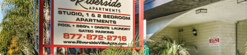 Apartments in Valley Village for Rent - Riverside Villa - Exterior of Orange Apartment Building with Monument Sign