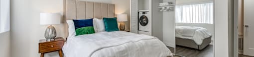 Two-Bedroom Apartments in Encino, CA- Brookside Terrace Apartments- Bedroom with White Bedding, Mirror Closet Sliding Doors, and Double Nightstands