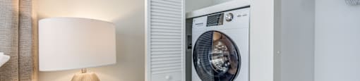 a washer and dryer in a bedroom