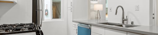 Apartment Valley Village CA - Kling Trio - Modern Kitchen With Sleek Counters and Appliances Apartments Apartments