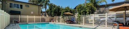 Luxury Apartments in Canoga Park For Rent - Parthenia Terrace - Gated Pool Surrounded by Lounge Seating