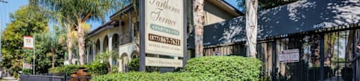 Apartments Canoga Park bush and building sign