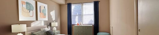 a bedroom with a bed and a ceiling fan at Huntington Green Apartments, Ohio