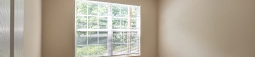 A room with a window and a door. at Highlands of Heritage Woods Apartments, Ohio, 44321