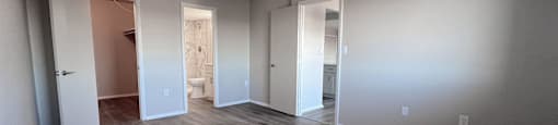 an empty living room with hard wood floors and white walls at Huntington Green Apartments, University Heights, Ohio